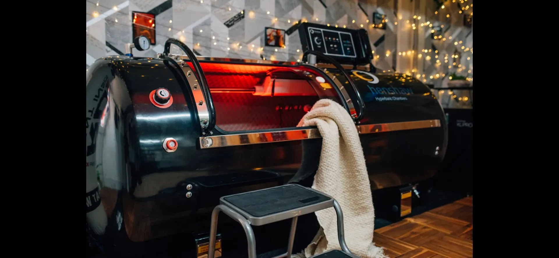 Hyperbaric chamber prepared beside monitoring equipment for a Hope House session